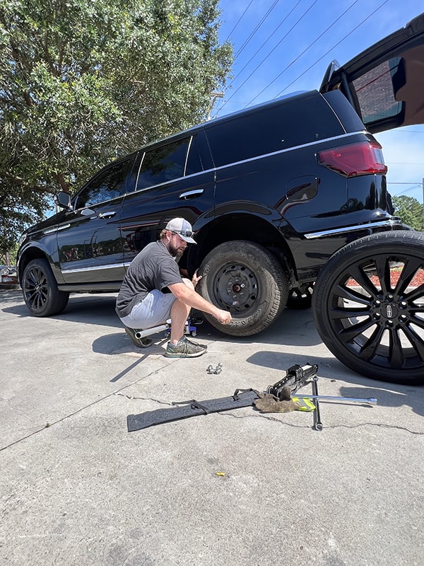 changing a tire on an SUV