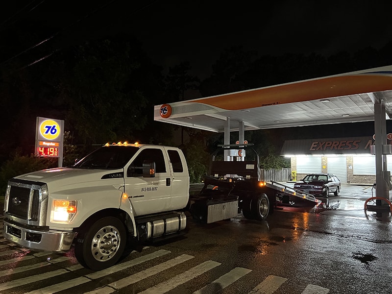 888 Tows tow truck at gas station