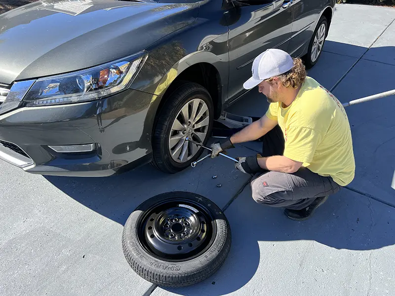Changing a flat tire to a spare tire